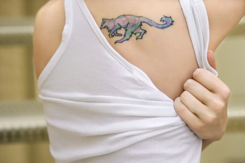 middle back tattoo of colorful fox on women