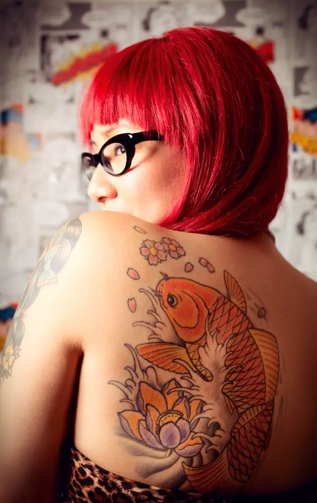 colorful carp back tattoos on red hair women