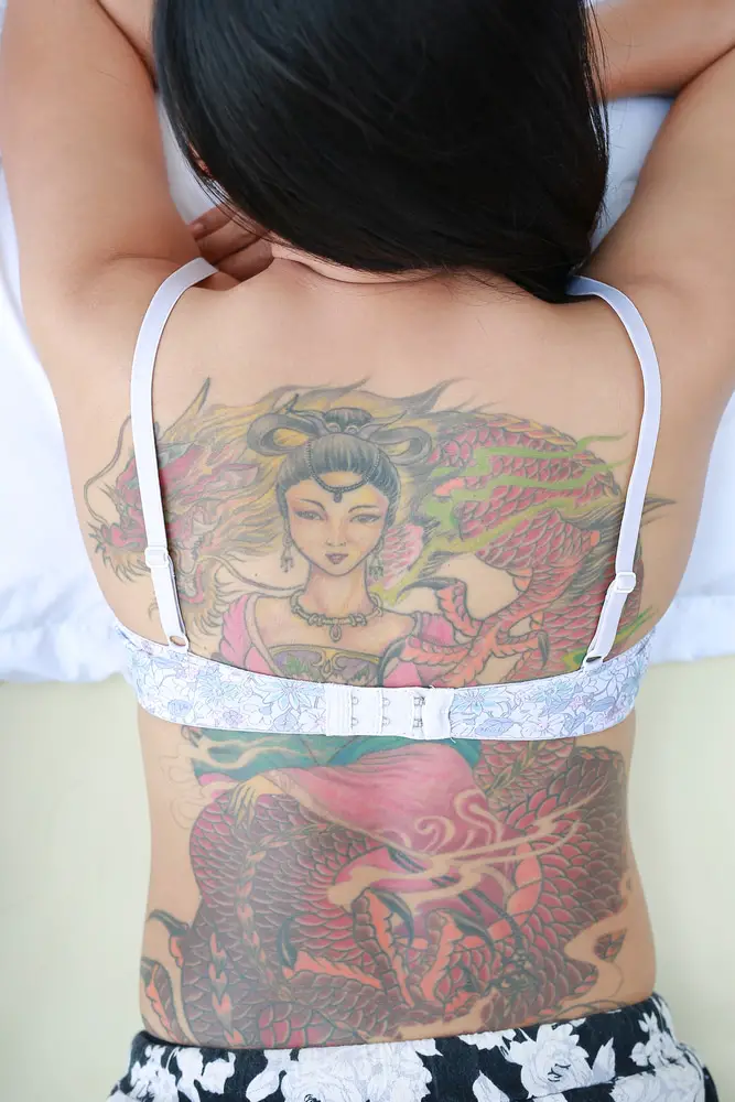 full back tattoo on women in bikini