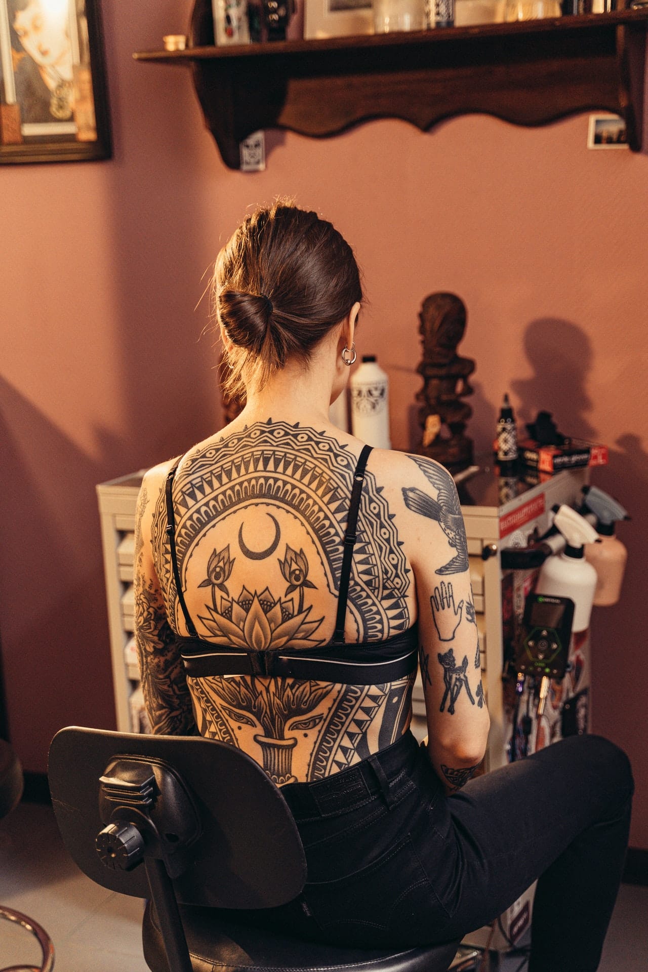 black back tattoos all over back of women