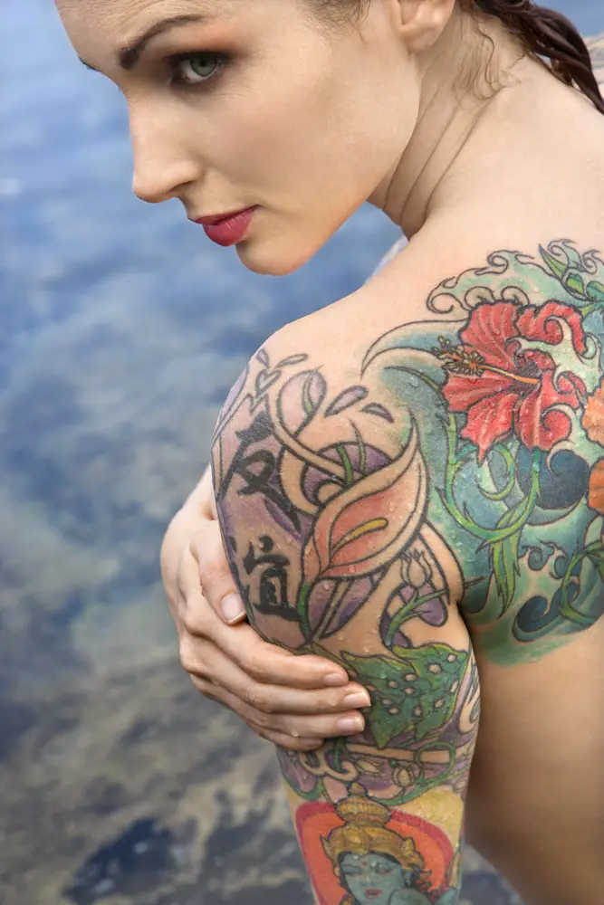 colorful back and shoulder tattoos on young women