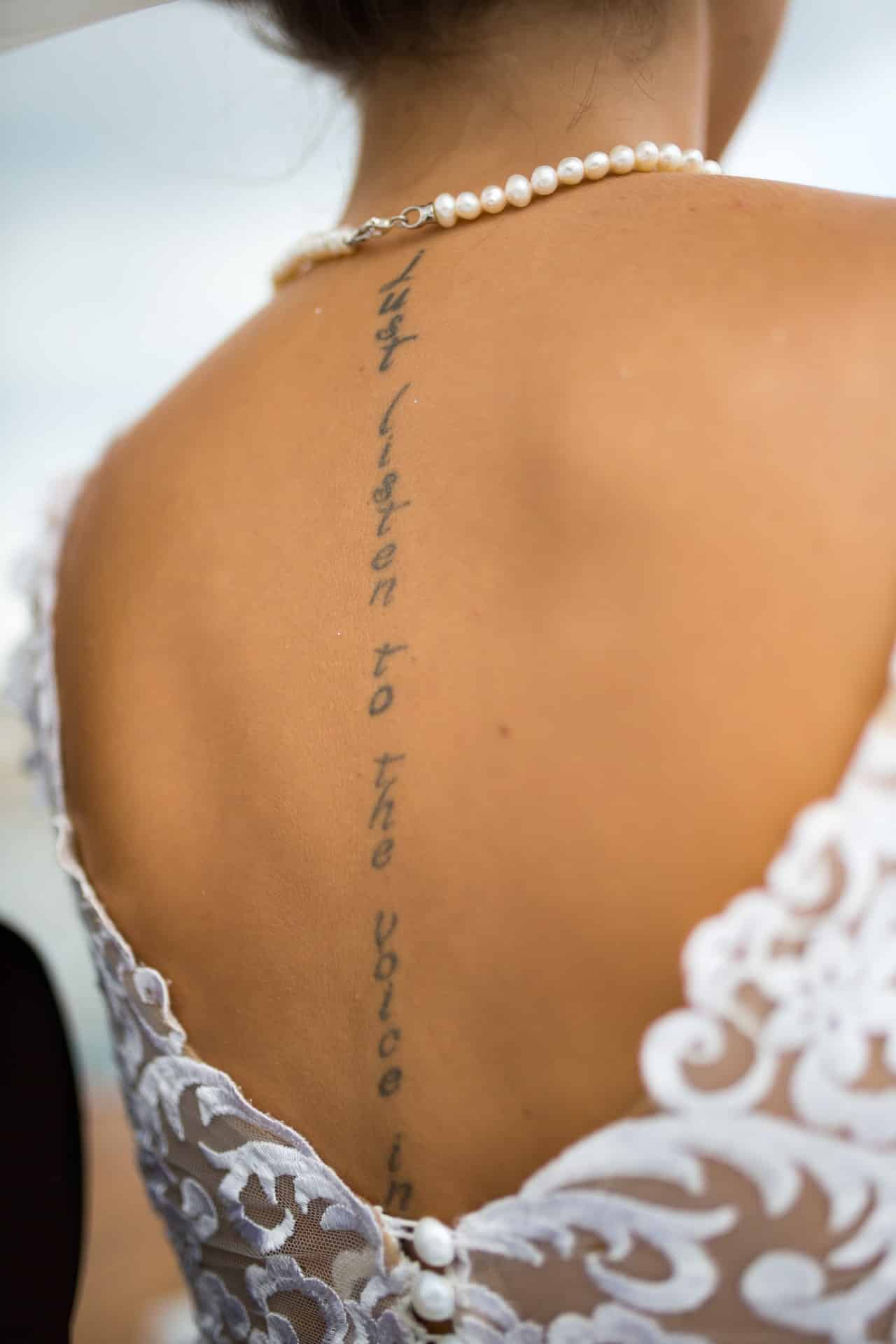 Text on Spine Back Tattoo