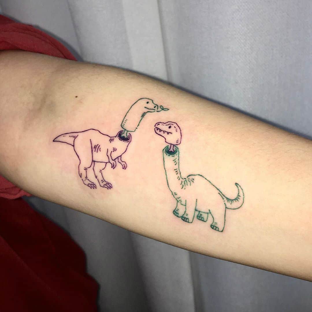 Danelle and Cullens matching little dino tattoos  Dollys Skin Art Tattoo  Kamloops BC