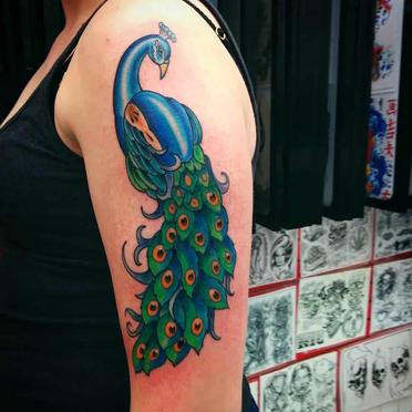 22 Stunning Peacock Tattoo Designs and Where to Ink Them