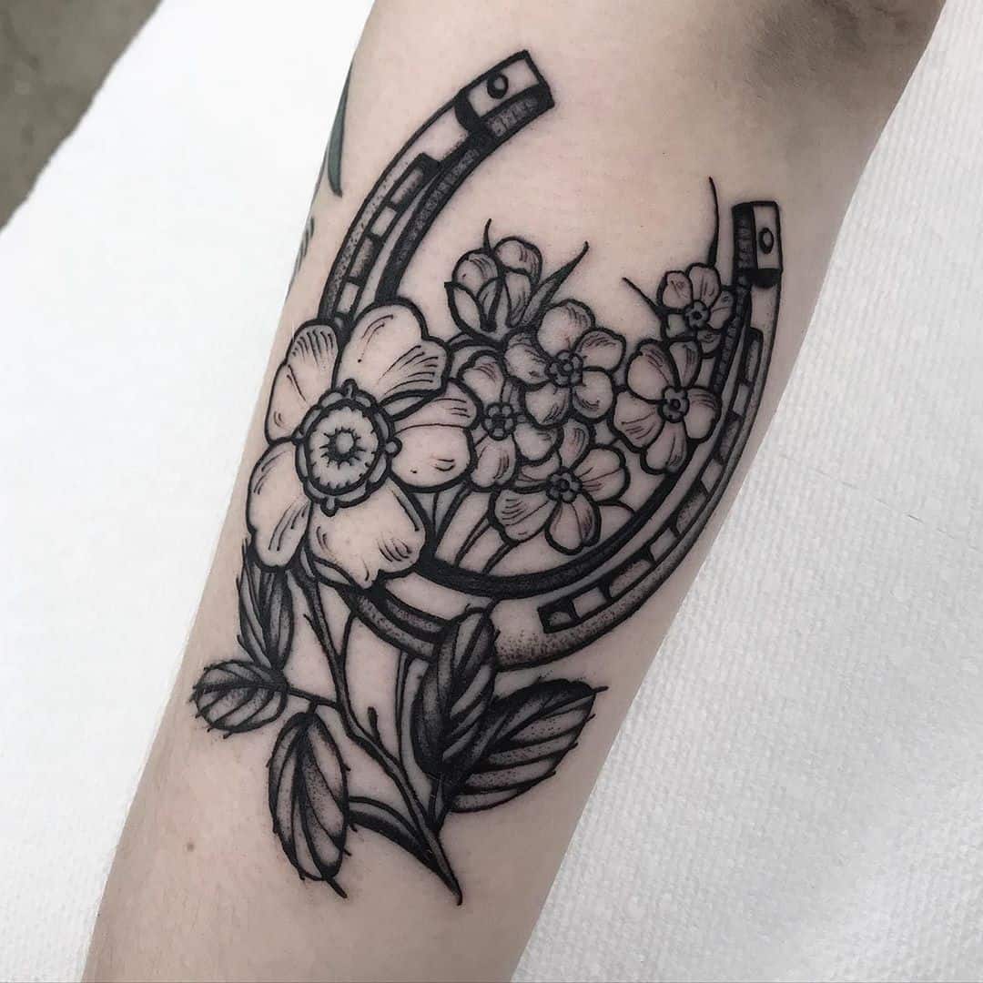 This is a horseshoe and flowers Apparently  rshittytattoos