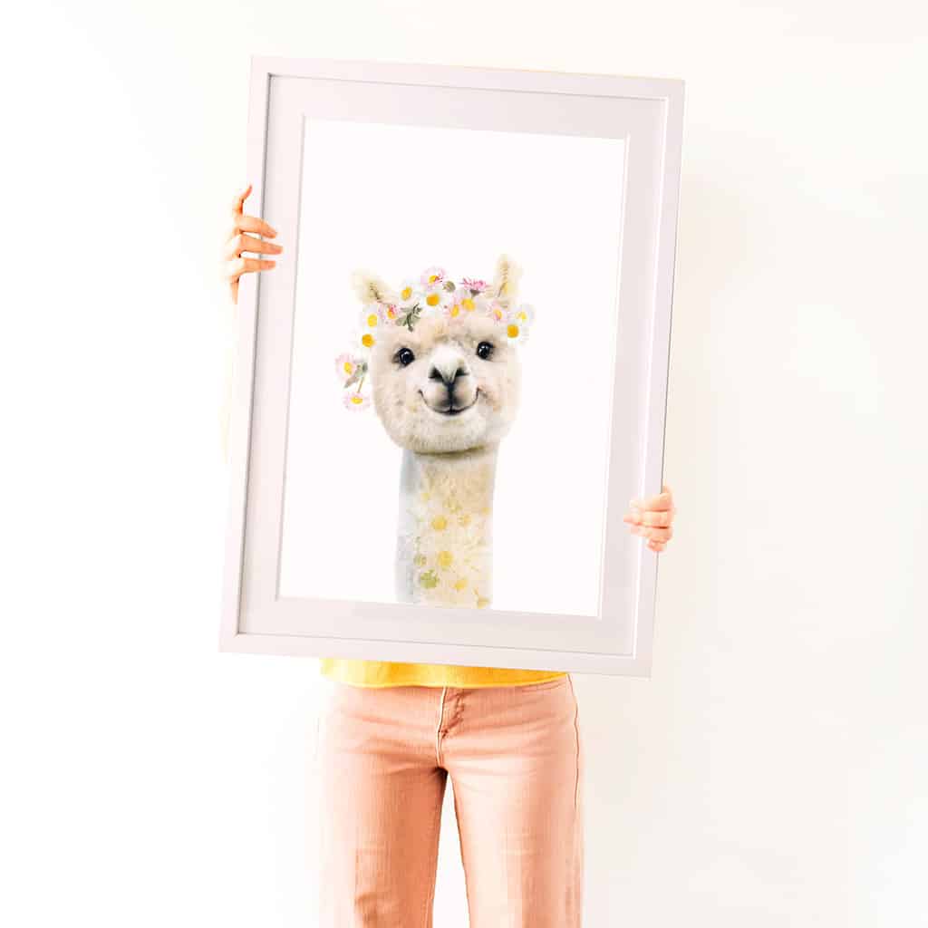 a cute white alpaca painting with flowers on its head
