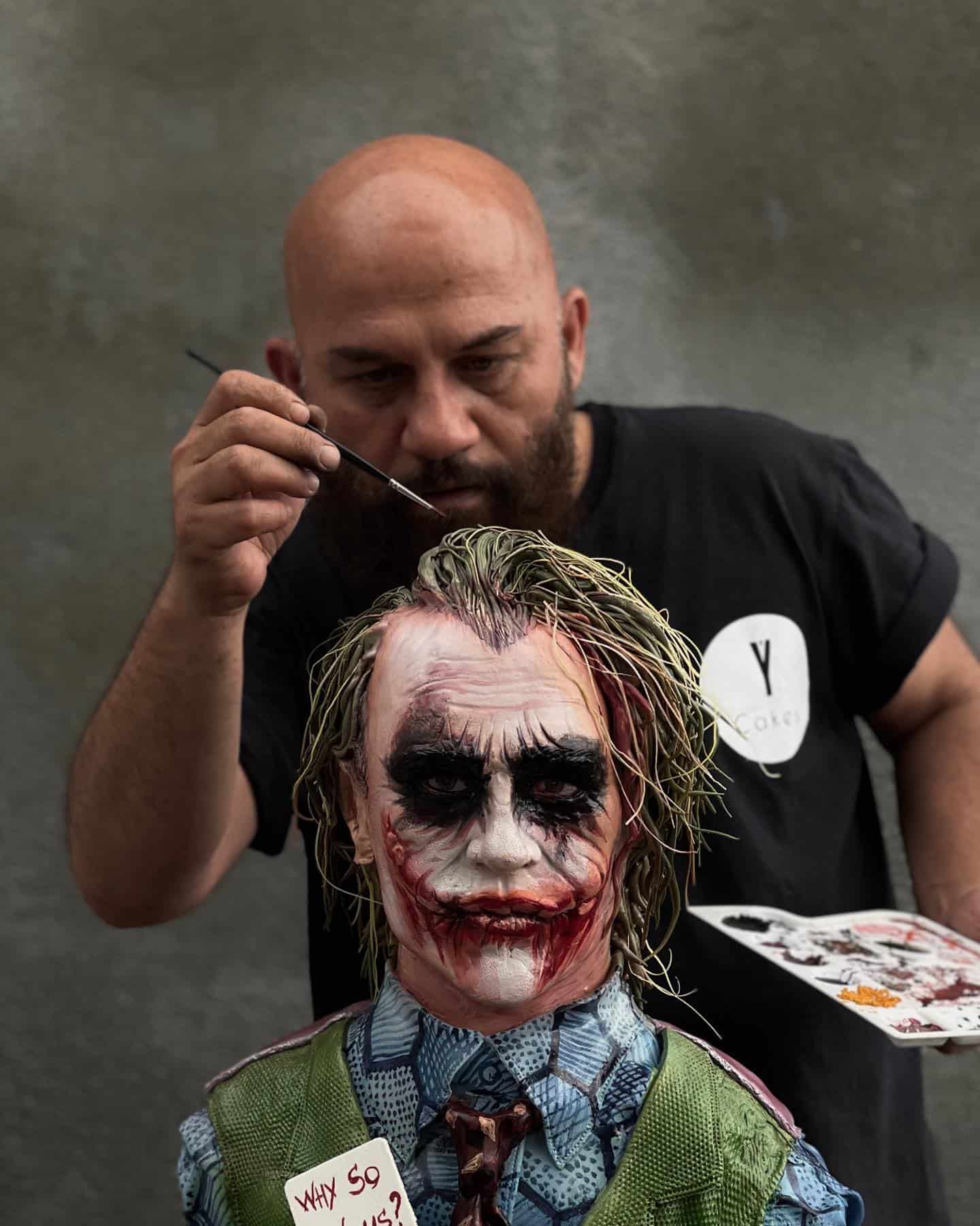 cake artist paints realistic cake of the joker