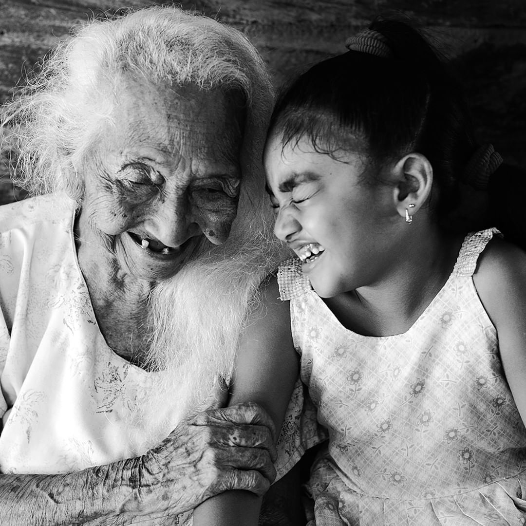an image of an elderly with her grandchild captured in black and white