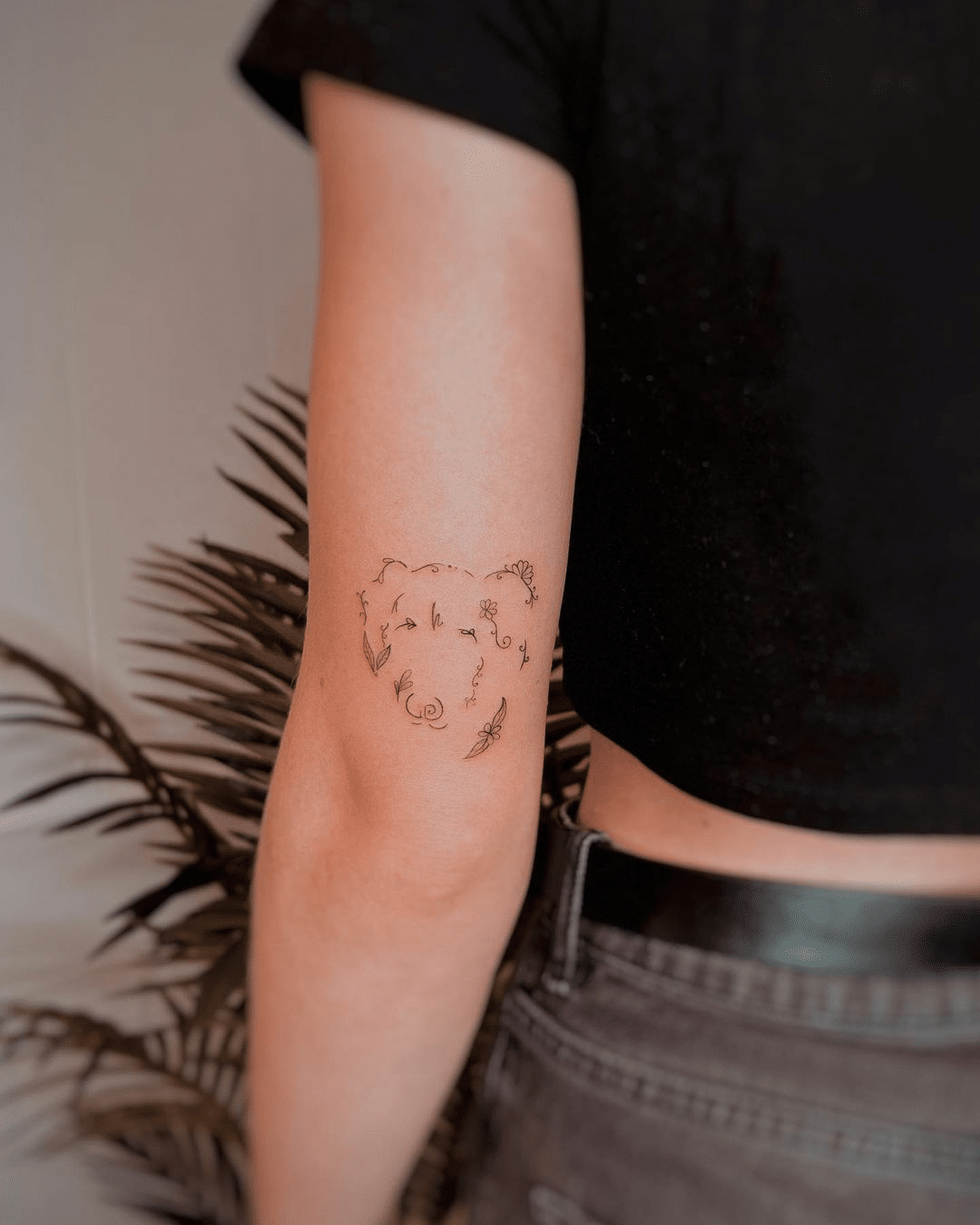 unique small dog arm tattoo for women