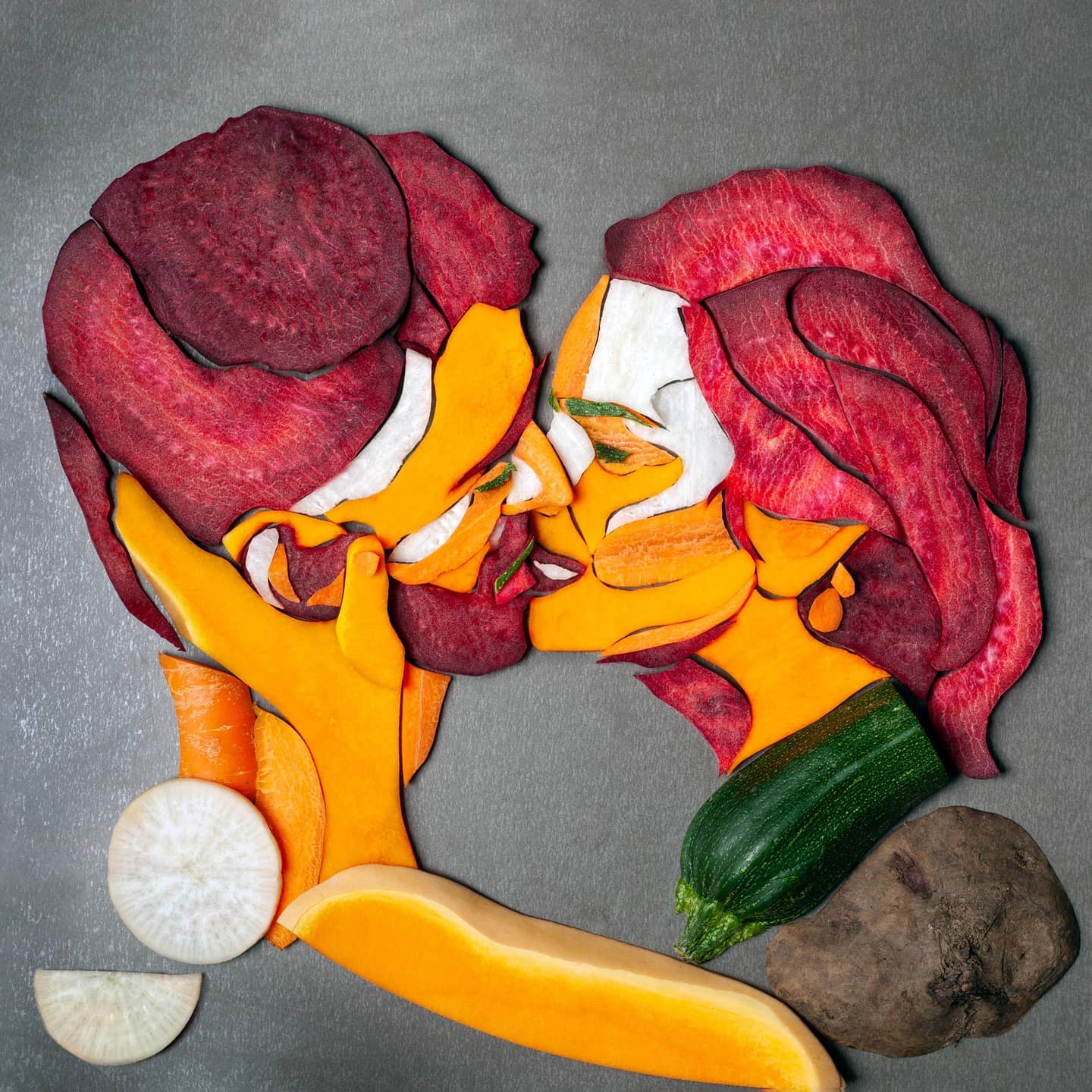 bright vegetable art of two people kissing