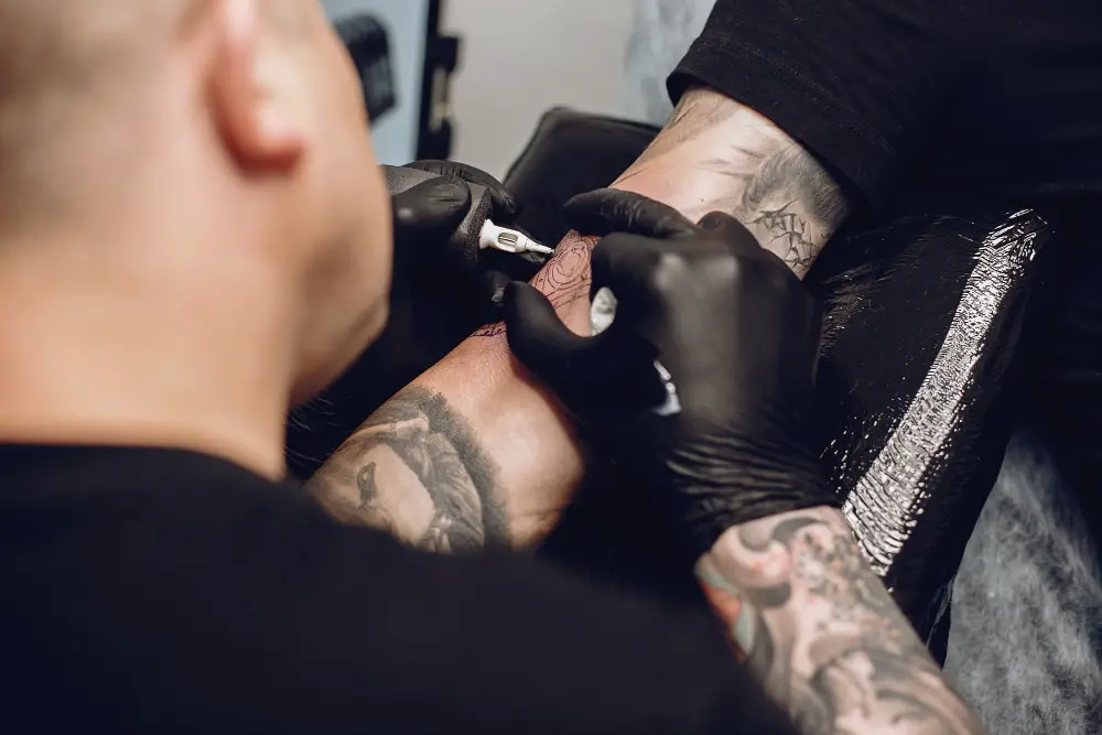 black arm sleeve by tattoo artist