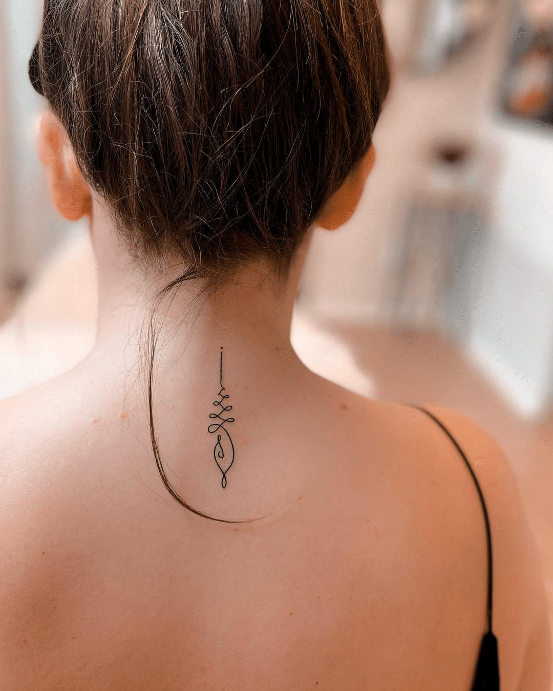 nape line tattoo design for women