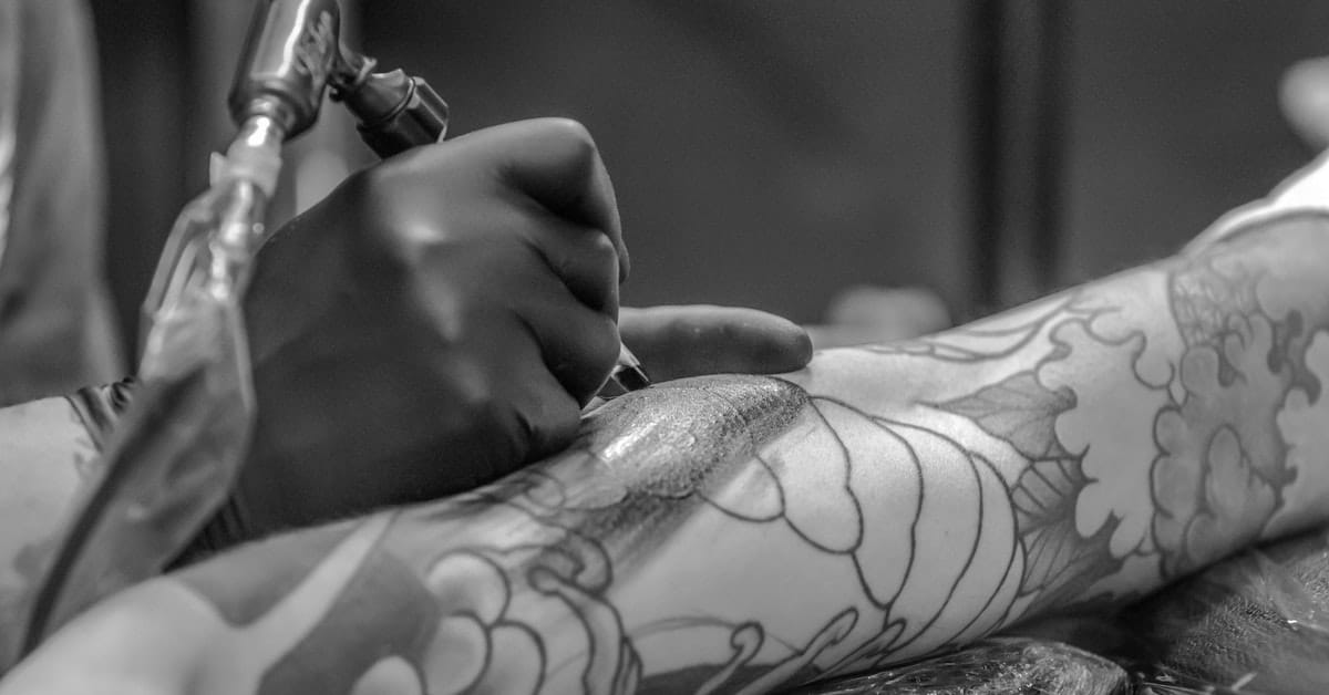 Getting Tattooed on Arm Getting Tattooed on Arm