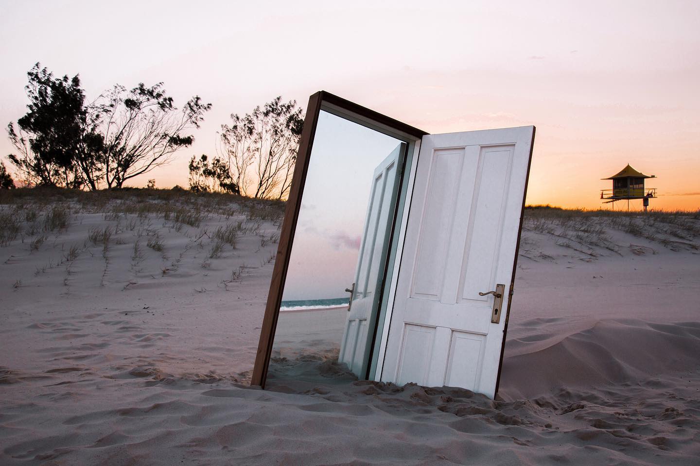 an art installation outdoor of a door and a mirror 