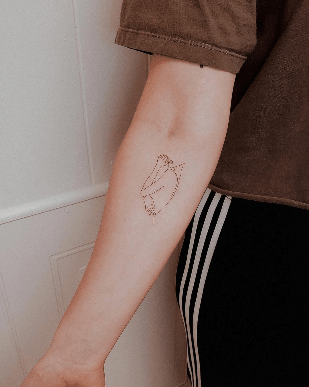 simple line art tattoo design for women