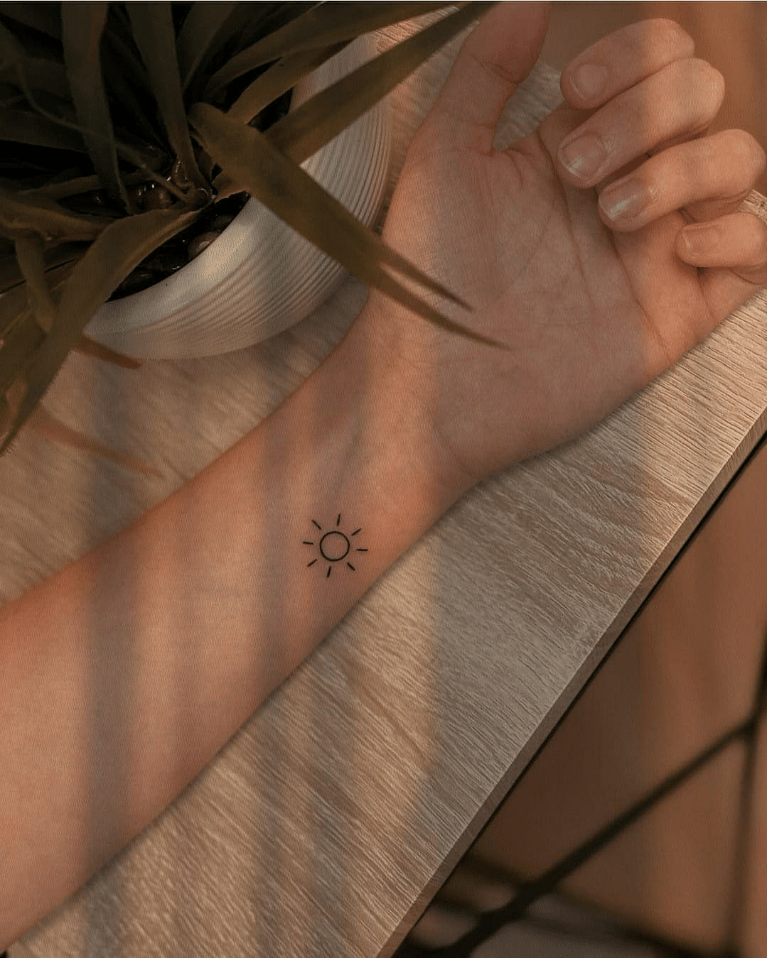 simple sun arm tattoo design for girls