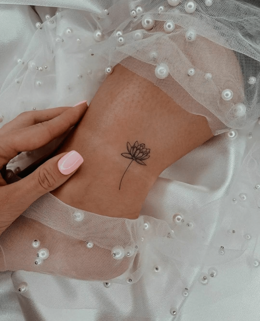 small lotus leg tattoo for girls