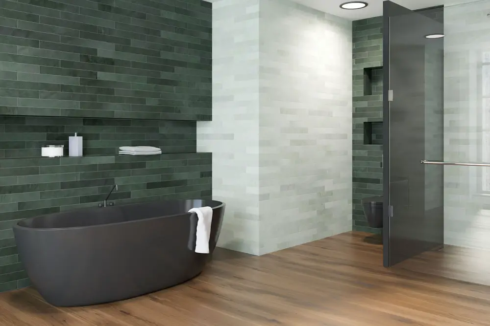 emerald green mosaic tiles combined with matte finish white wall tiles and wood panel dark brown flooring and dark gray tub bathroom