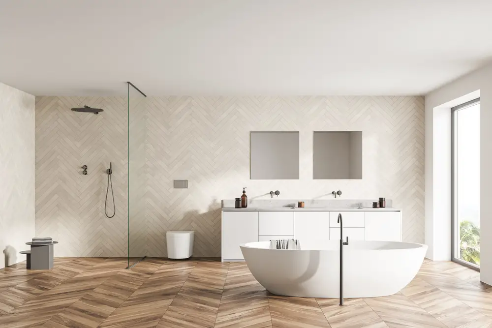 a pearl white scandinavian inspired bathroom with wooden parquet floor 