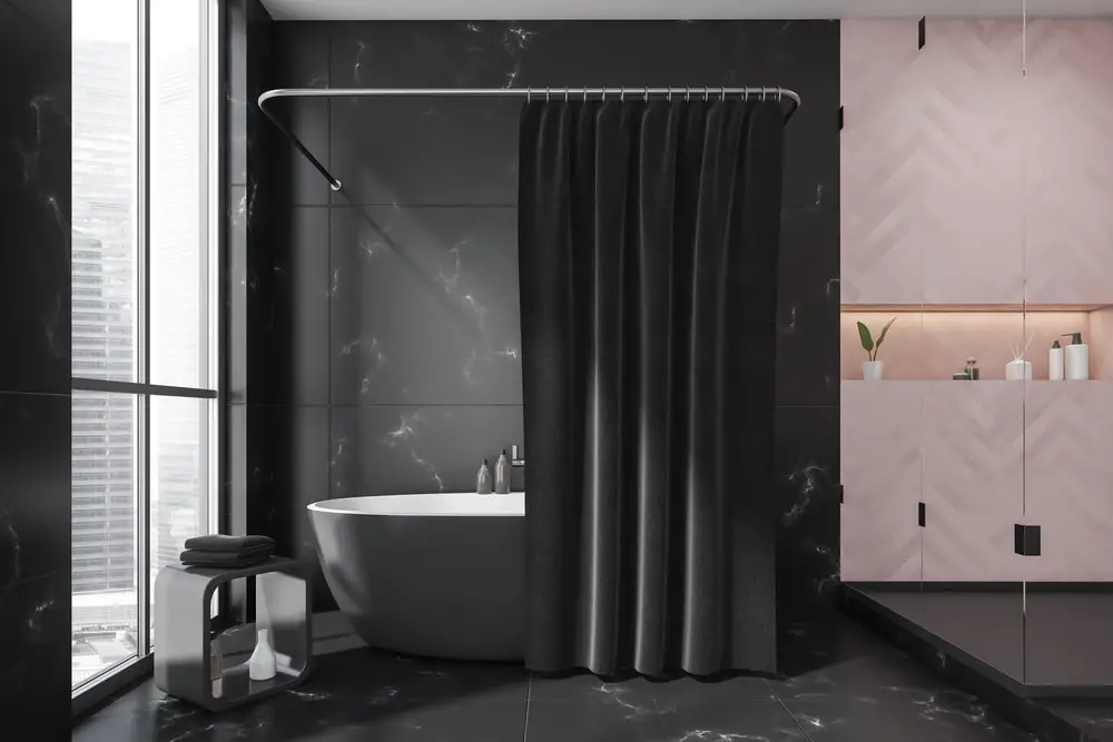 a luxurious black bathroom design with herringbone patterned wall