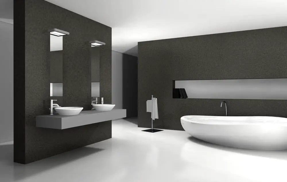 a modern minimalist bathroom design with dark gray textured wall acrylic silken white tub tabletop sink and chrome finish bathroom fixtures