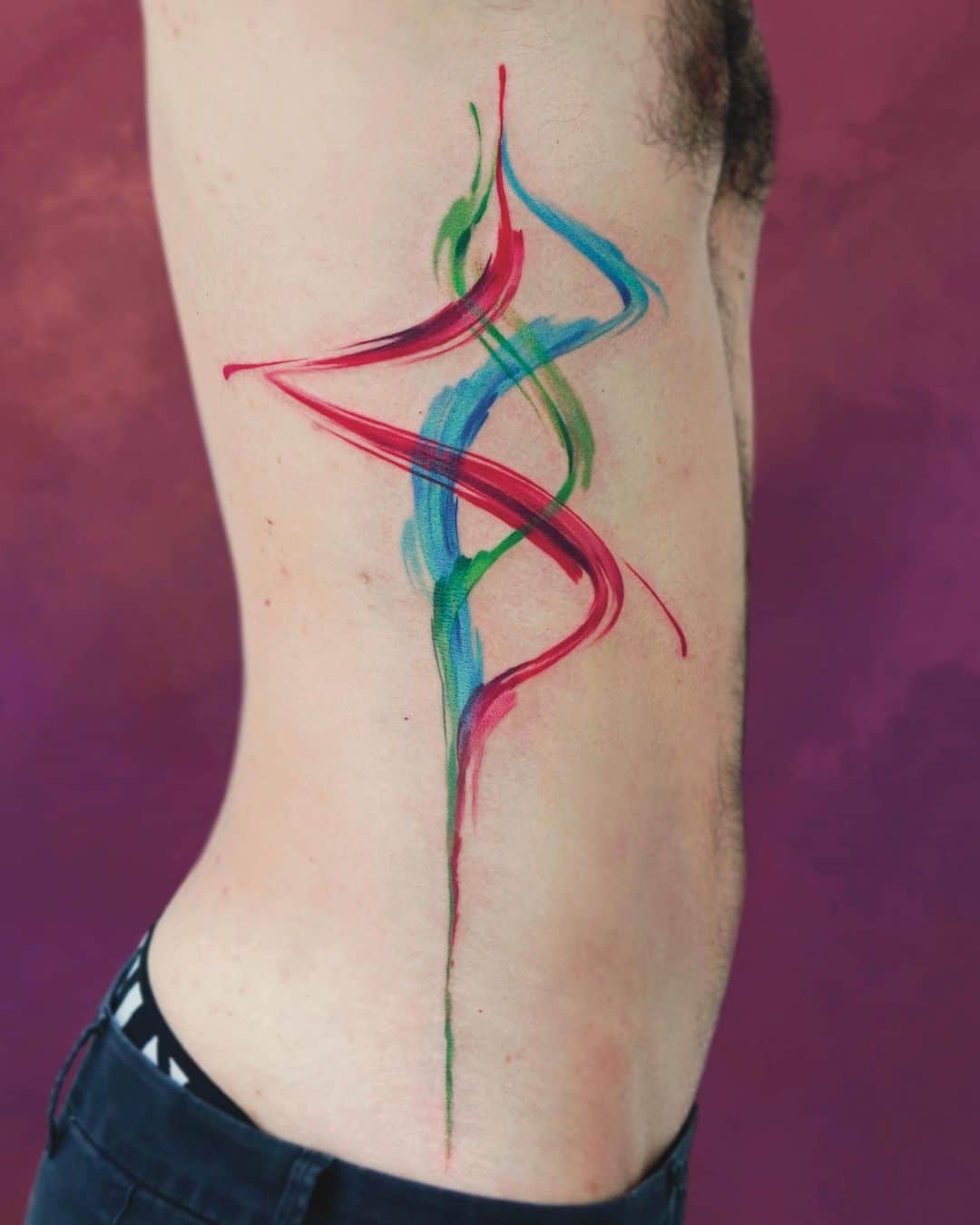 Abtract Colorful Tattoo On The Rib