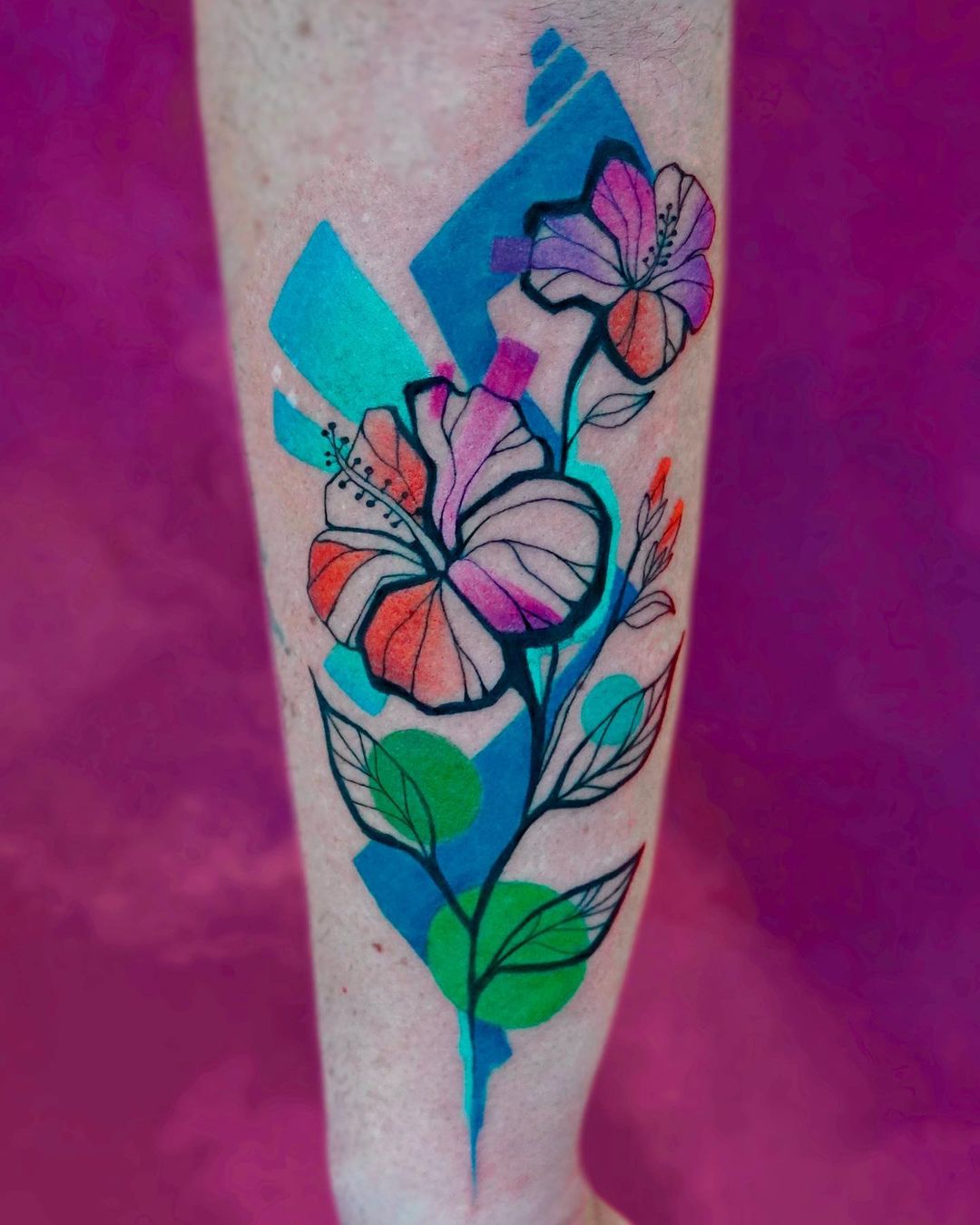 colorful hibiscus tattoo on arm