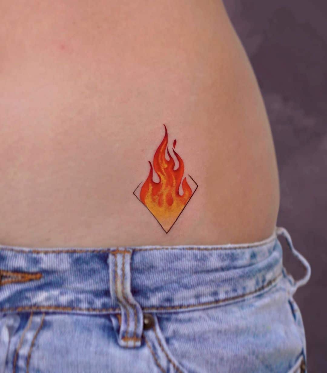 minimalist colorful fire tattoo