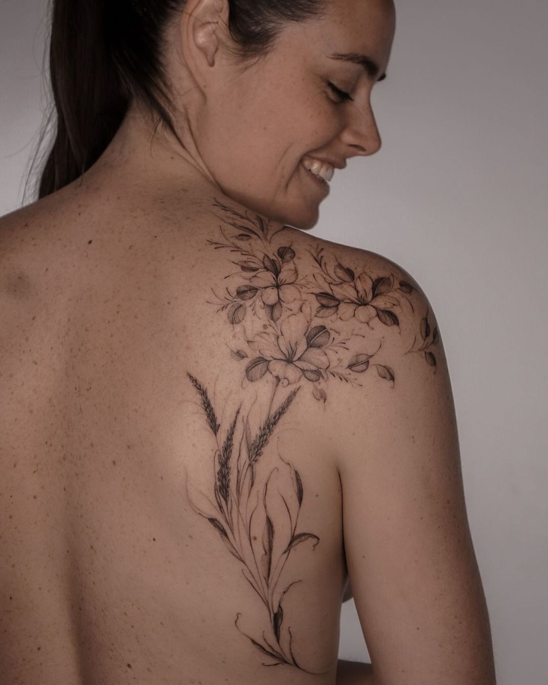 incredible back flower tattoo for women