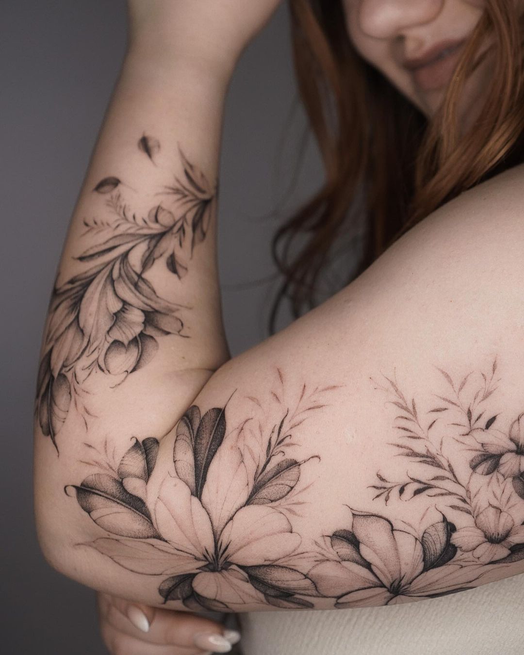 delicate sleeve flower tattoos on the arm