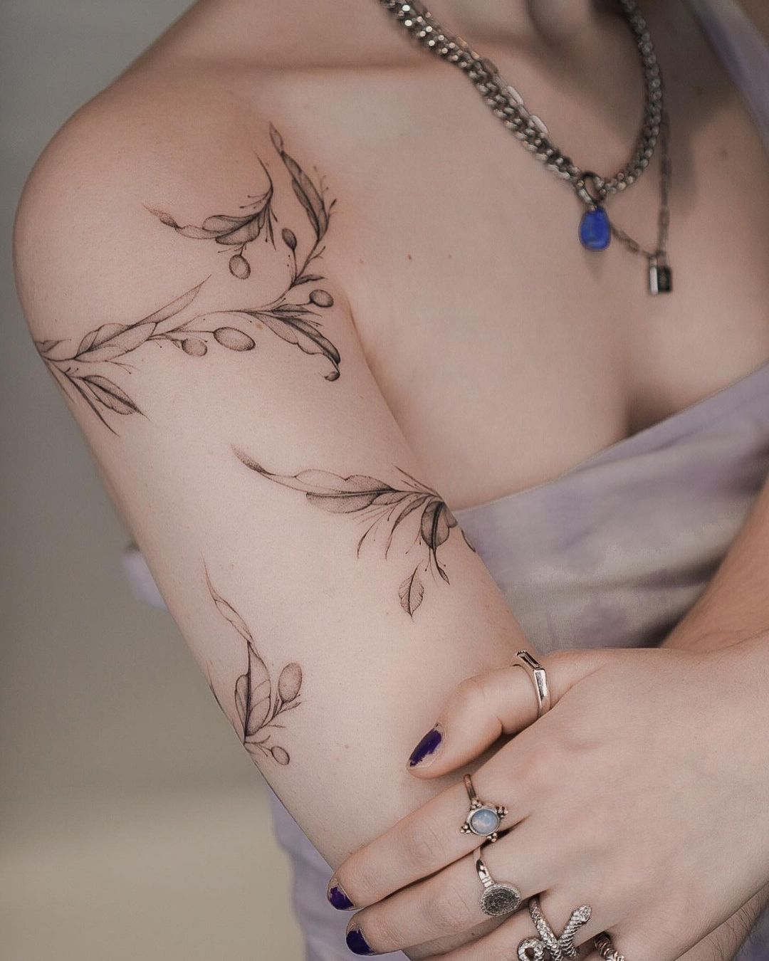 delicate arm flower tattoo 