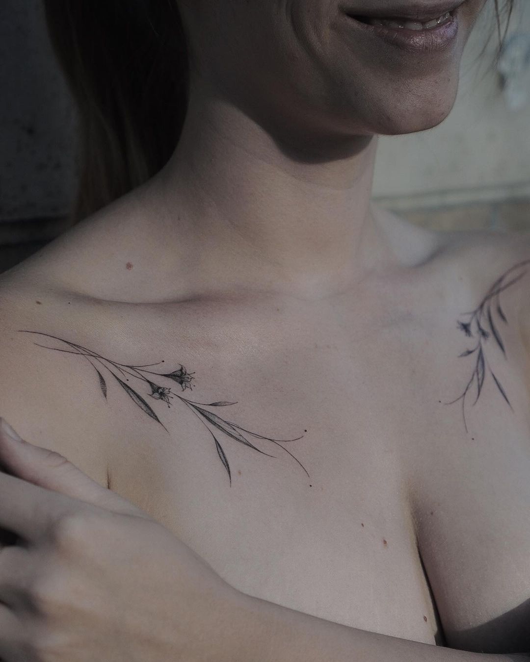 beautiful shoulder flower tattoo on a woman