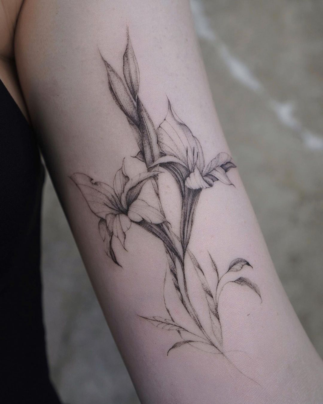 beautiful flower tattoos on a womans forearms