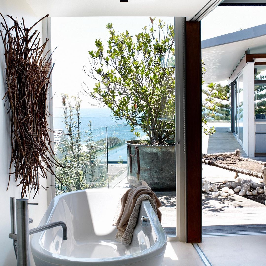 interior design of a bathroom with glass walls