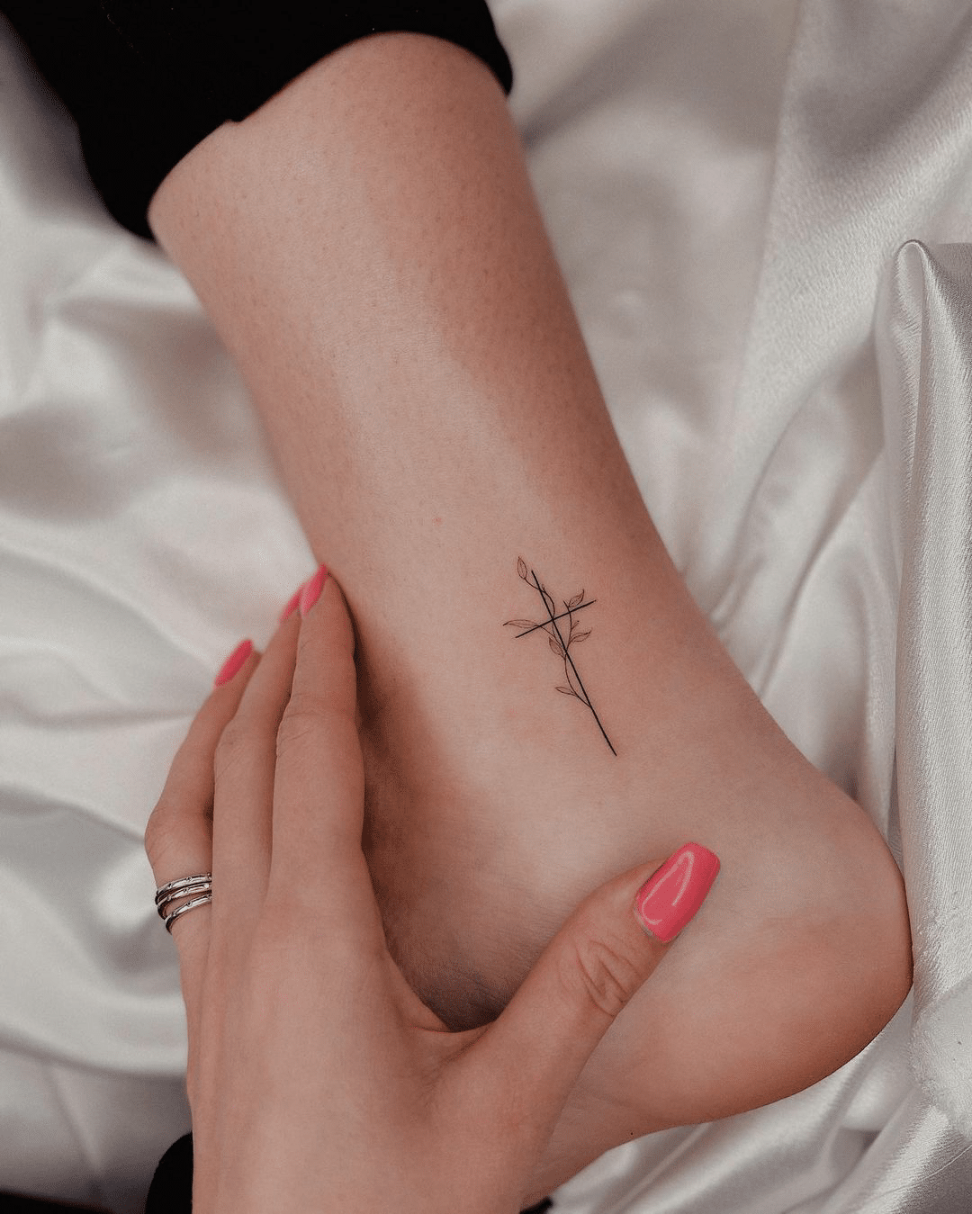 small cross arm tattoo idea for women