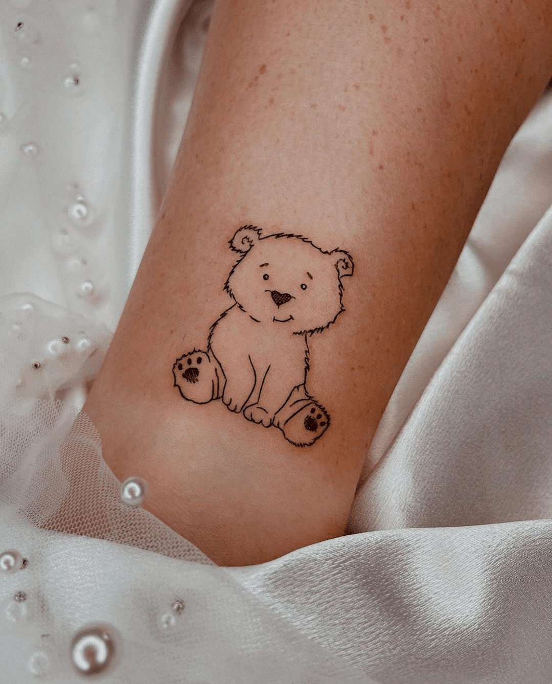 small teddy bear tattoo idea for women