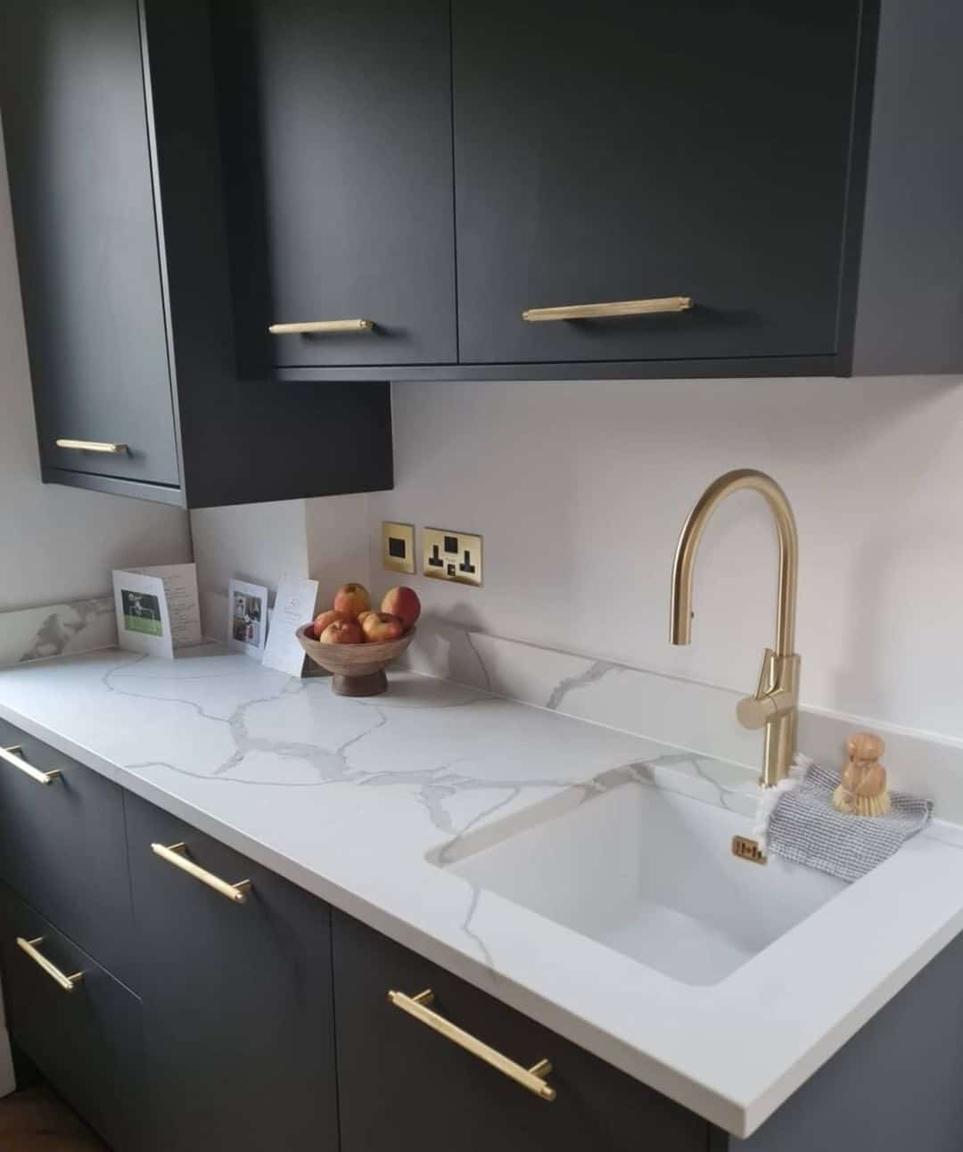 an elegant kitchen with elegant gold polished kitchen faucet