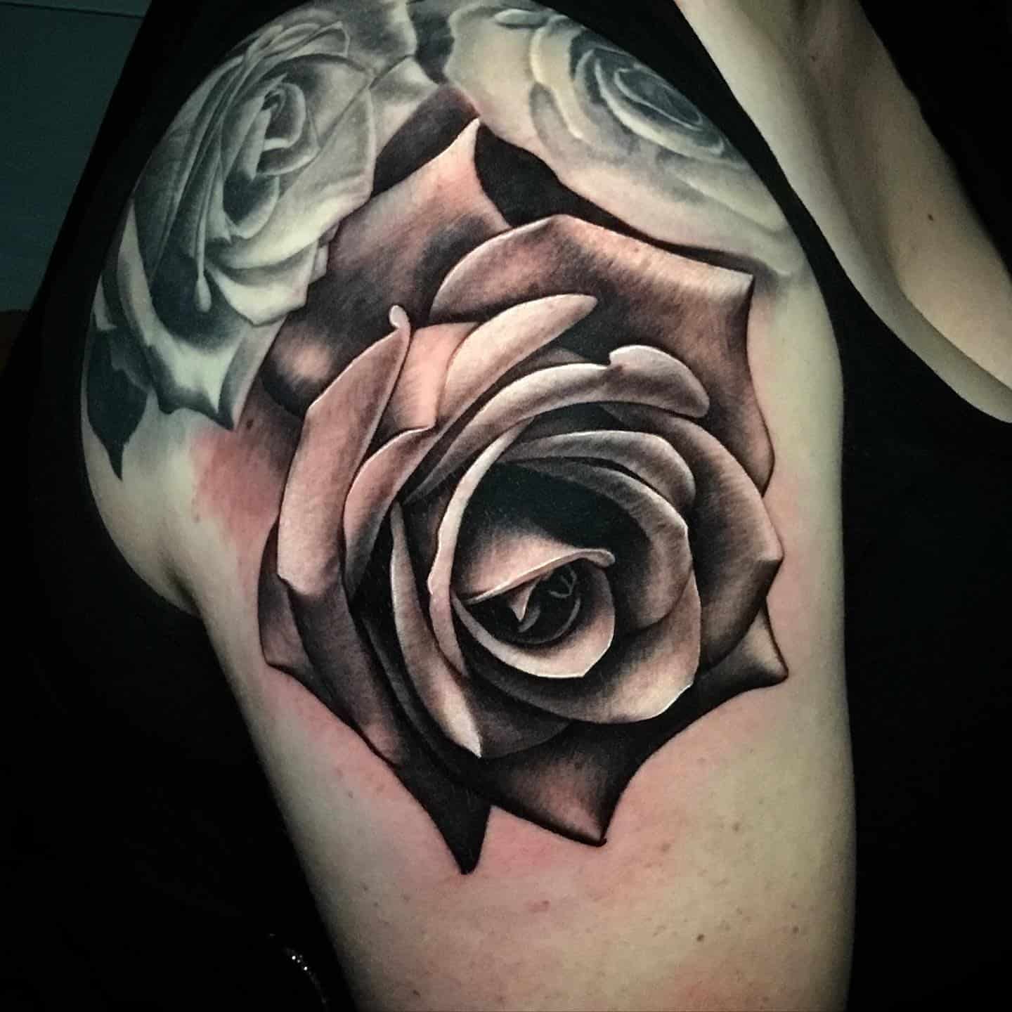 realistic black and gray tattoo on arms