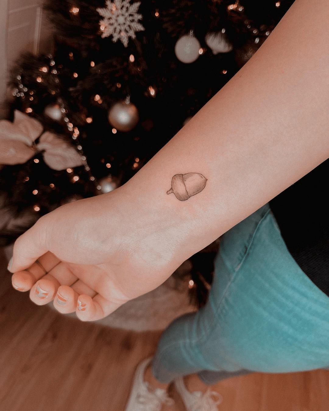 small acorn arm tattoo design for girls