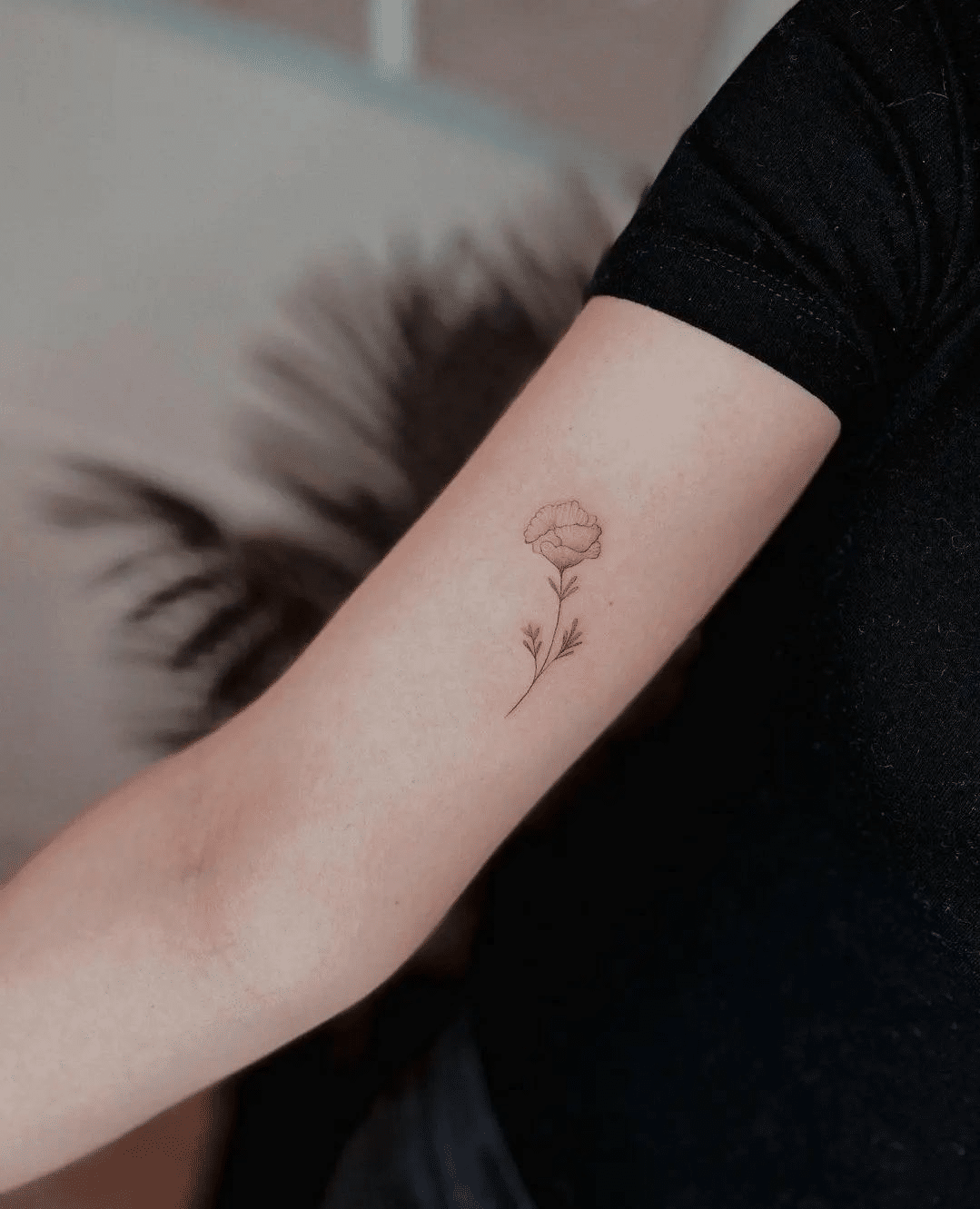 tiny floral fine line tattoo