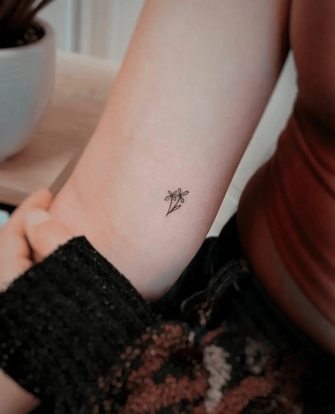 small flower line tiny tattoo idea for girls