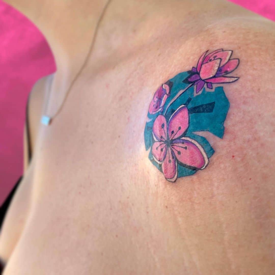 floral small colorful tattoo on shoulder