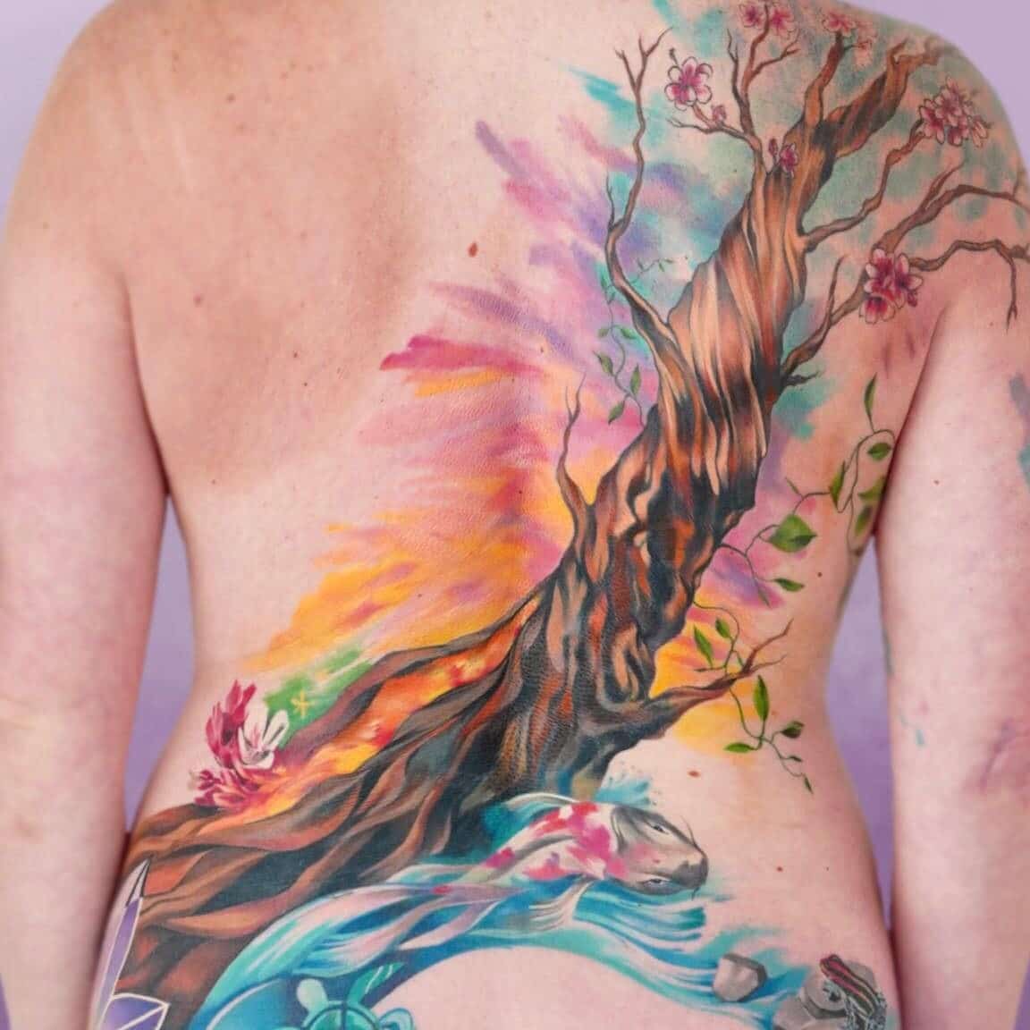 large scale nature themed colorful tattoo