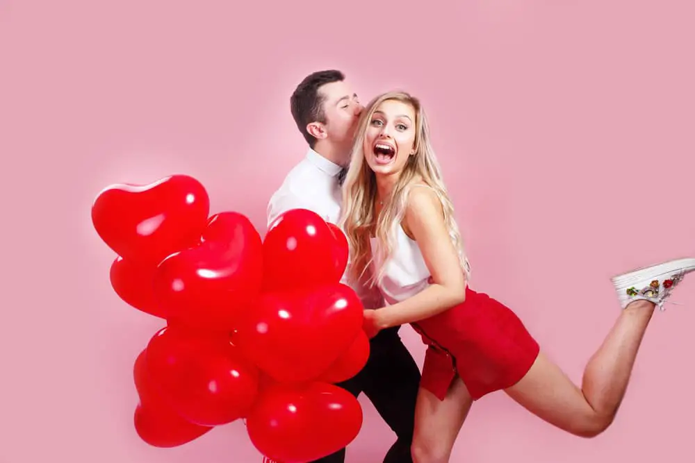 happy couple with balloons on valentines day